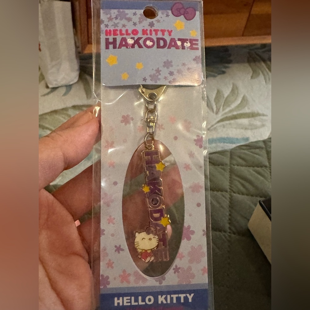 Sanrio Hello Kitty Hakodate Keychain with Purple and Gold Accents